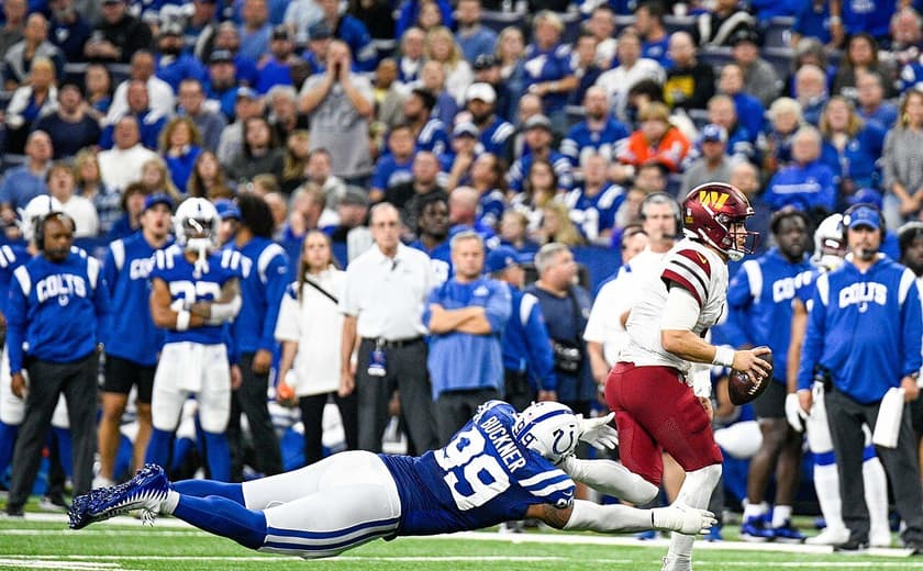 DeForest Buckner, attempting to tackle Washington Commanders quarterback